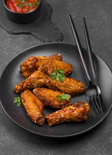Ailes de poulet frits à la sauce épicée